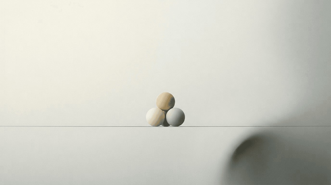 Abstract study: soft spheres clustered on pale mist with a fine horizon line.