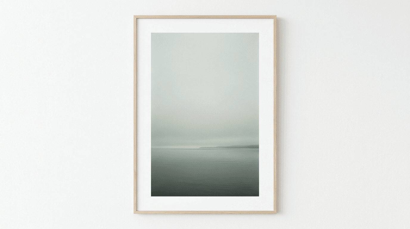 Minimal horizon where mist meets calm water—meditative negative space study.